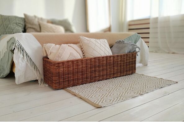 Bedside basket for storing pillows and blankets